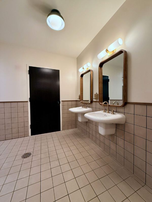 Vintage tile restroom flooring installed in renovated Church of Pickleball in Chicago IL commercial renovation project