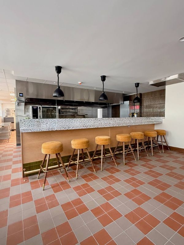 Commercial kitchen space with durable tile flooring installed during Church of Pickleball renovation in Chicago Illinois