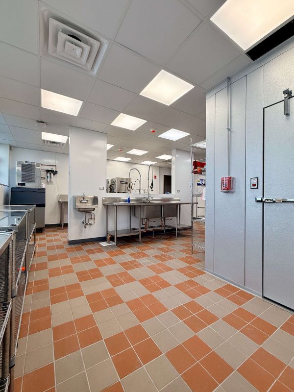 Commercial tile flooring installed in bar and dining area at Church of Pickleball adaptive reuse project in Chicago Illinois